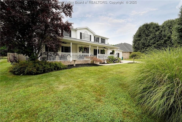 8 Anchors Way, Winfield, WV 25213 - farmhouse featuring a porch, a front lawn, an attached garage, and a ceiling fan