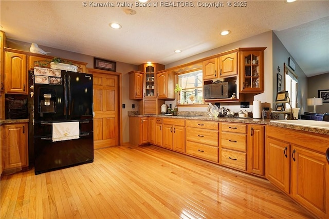 8 Anchors Way, Winfield, WV 25213 - kitchen featuring black appliances, brown cabinets, glass insert cabinets, and recessed lighting