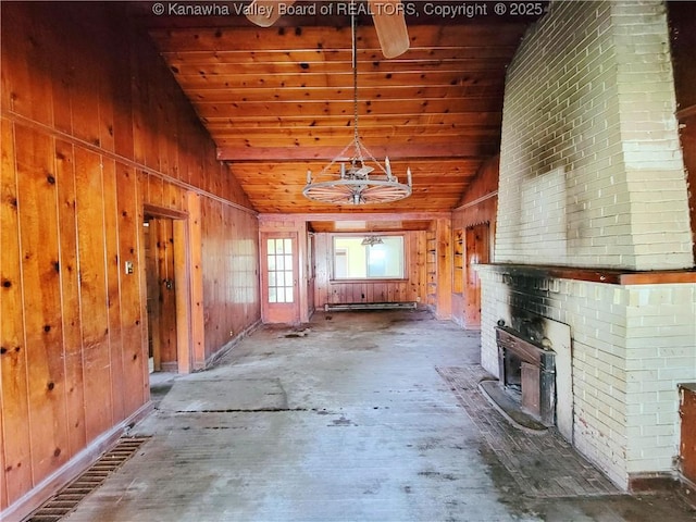 200 Boone St, Saint Albans, WV 25177 - unfurnished living room with a fireplace, a chandelier, a baseboard heating unit, wooden walls, and wood ceiling