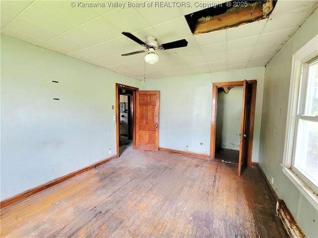 200 Boone St, Saint Albans, WV 25177 - unfurnished bedroom featuring hardwood / wood-style floors, a drop ceiling, and multiple windows