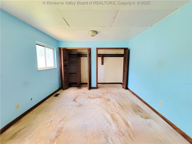 200 Boone St, Saint Albans, WV 25177 - unfurnished bedroom with baseboards and multiple closets