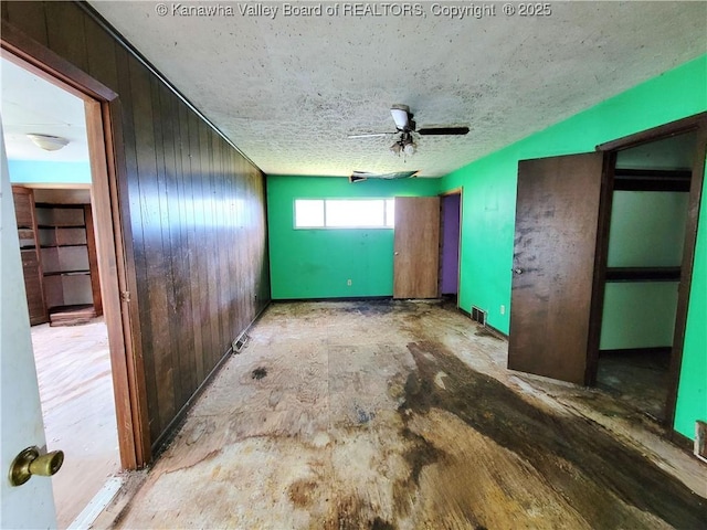 200 Boone St, Saint Albans, WV 25177 - empty room featuring ceiling fan and wooden walls