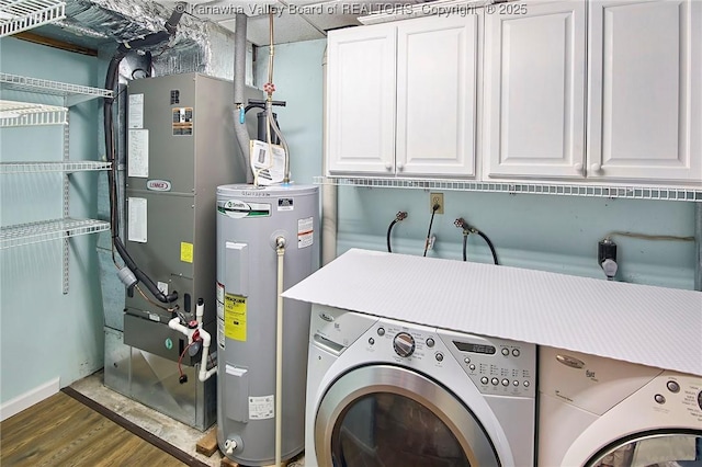 5301 Balsam Cir, Charleston, WV 25313 - washroom with electric water heater, separate washer and dryer, cabinet space, wood finished floors, and heating unit