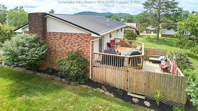 5301 Balsam Cir, Charleston, WV 25313 - view of side of home featuring a wooden deck, brick siding, a lawn, a chimney, and an outdoor living space