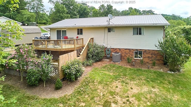 5301 Balsam Cir, Charleston, WV 25313 - rear view of property featuring a deck, a lawn, and a metal roof