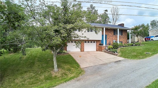 5301 Balsam Cir, Charleston, WV 25313 - raised ranch with brick siding, a chimney, a front yard, driveway, and an attached garage