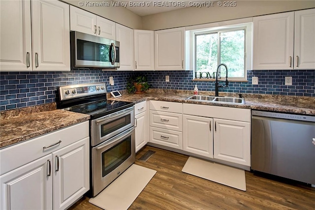 5301 Balsam Cir, Charleston, WV 25313 - kitchen featuring appliances with stainless steel finishes, white cabinetry, and dark countertops