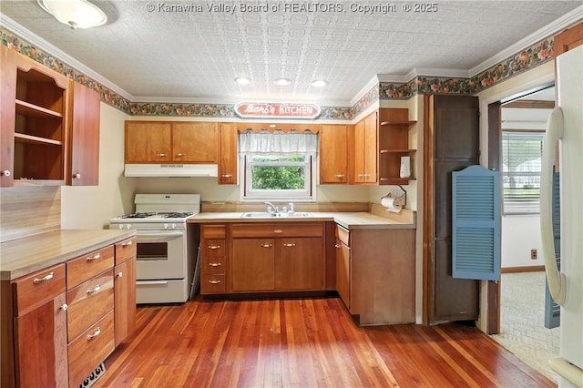 3223 Georges Dr, Saint Albans, WV 25177 - kitchen with open shelves, white range with gas cooktop, under cabinet range hood, hardwood / wood-style floors, and brown cabinetry