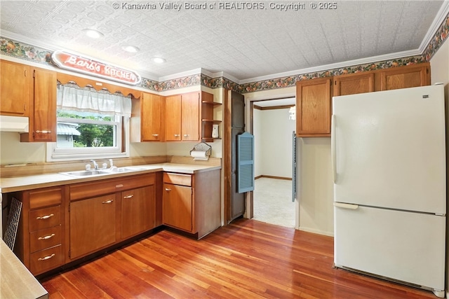 3223 Georges Dr, Saint Albans, WV 25177 - kitchen with freestanding refrigerator, an ornate ceiling, range hood, light wood finished floors, and light countertops