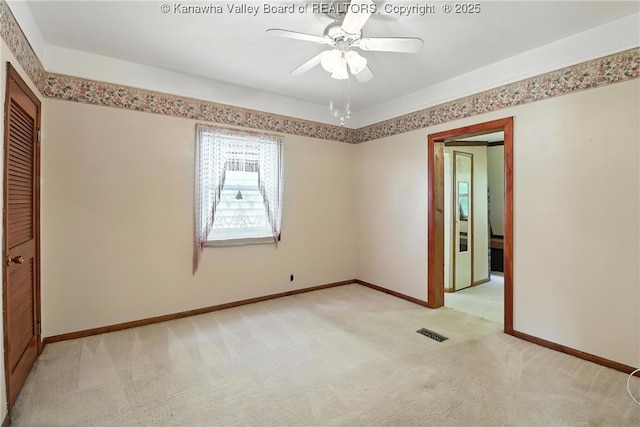 3223 Georges Dr, Saint Albans, WV 25177 - unfurnished bedroom with light colored carpet, a closet, and ceiling fan