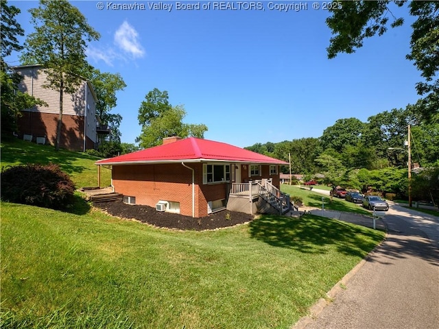 806 Whispering Way S, Charleston, WV 25303 - view of side of home with a yard, brick siding, a chimney, and a metal roof
