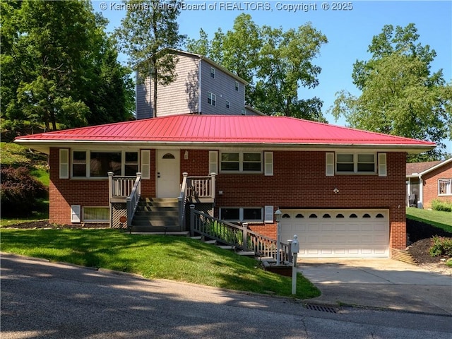 806 Whispering Way S, Charleston, WV 25303 - view of front of home with a garage, driveway, brick siding, a metal roof, and a front yard