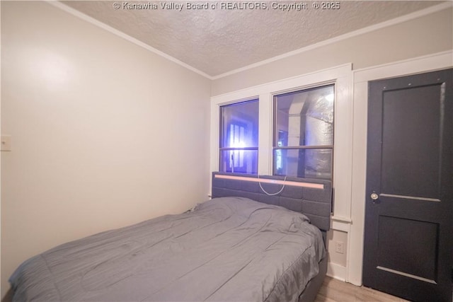 512 Maxwell St, Charleston, WV 25311 - bedroom with a textured ceiling, crown molding, and wood finished floors