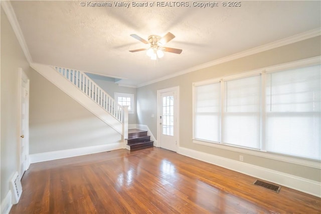 512 Maxwell St, Charleston, WV 25311 - unfurnished room featuring stairway, ceiling fan, wood finished floors, ornamental molding, and a textured ceiling