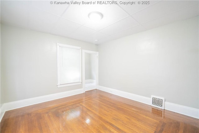 512 Maxwell St, Charleston, WV 25311 - unfurnished room featuring a drop ceiling and wood finished floors