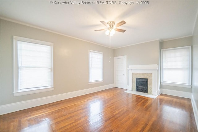 512 Maxwell St, Charleston, WV 25311 - unfurnished living room with a ceiling fan, crown molding, wood finished floors, and a fireplace with flush hearth