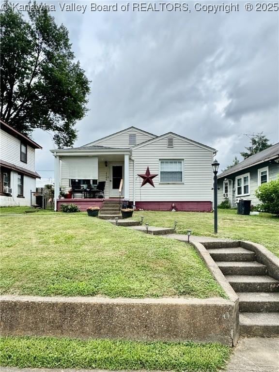 2406 Monroe Ave, Saint Albans, WV 25177 - view of front facade with a front yard
