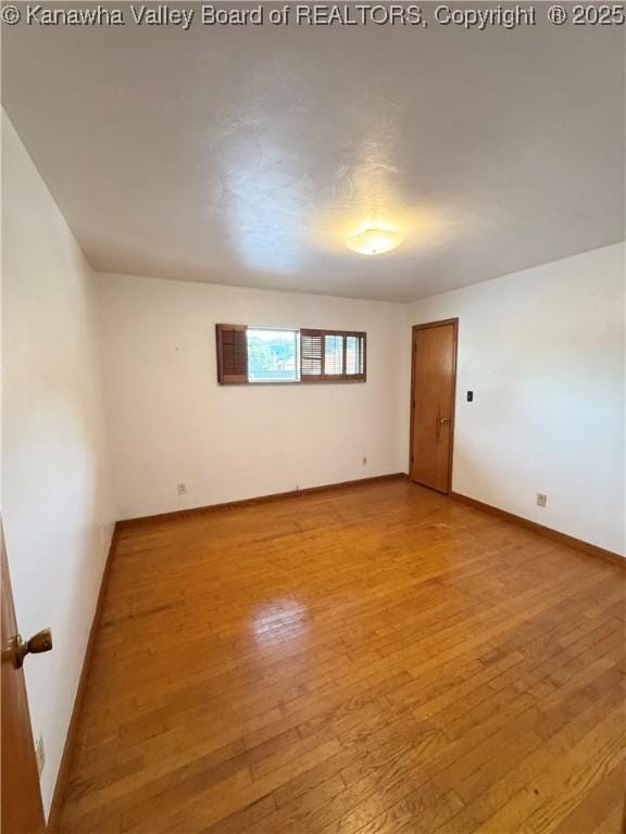 8612 Maryland Ave, Marmet, WV 25315 - unfurnished room featuring hardwood / wood-style flooring and baseboards
