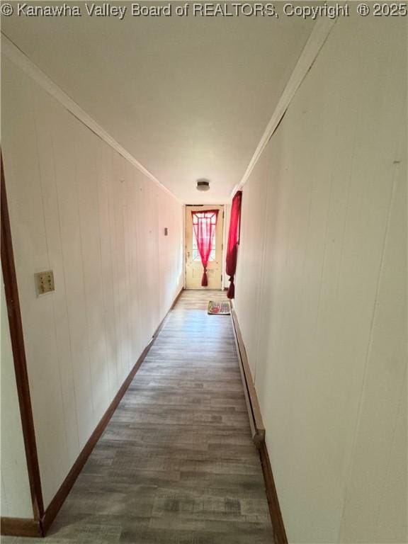 8612 Maryland Ave, Marmet, WV 25315 - hall with dark wood-type flooring, crown molding, and a baseboard heating unit