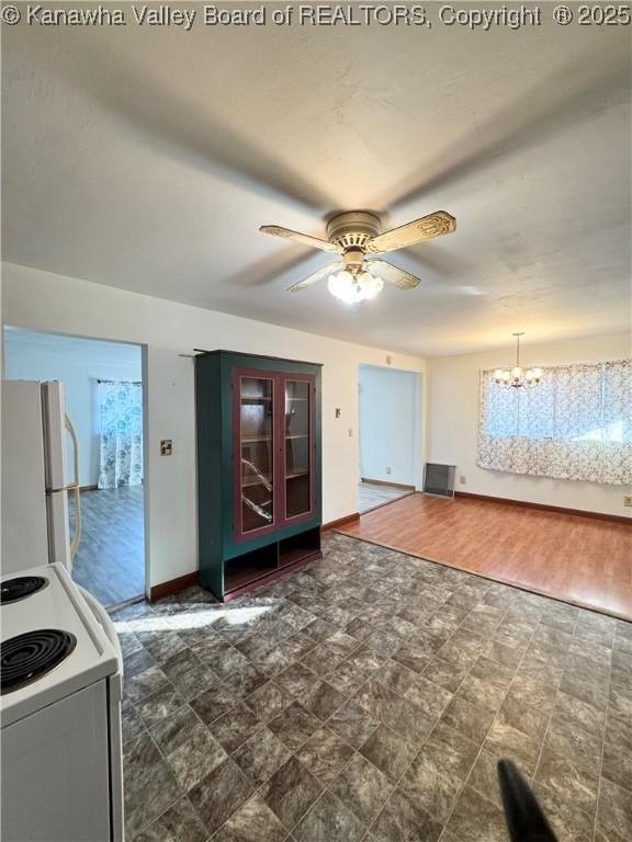 8612 Maryland Ave, Marmet, WV 25315 - kitchen featuring freestanding refrigerator, electric range, a ceiling fan, and a chandelier