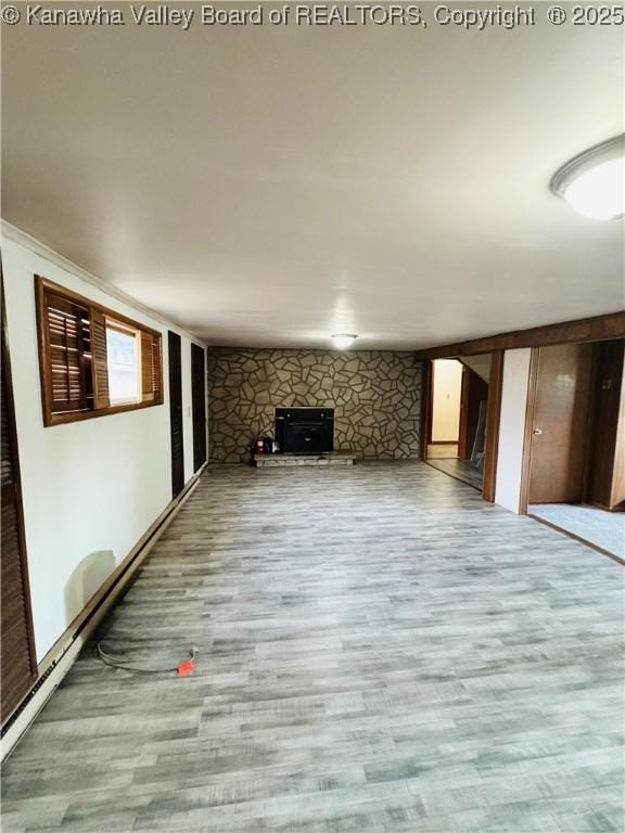 8612 Maryland Ave, Marmet, WV 25315 - unfurnished living room with wood finished floors and a fireplace