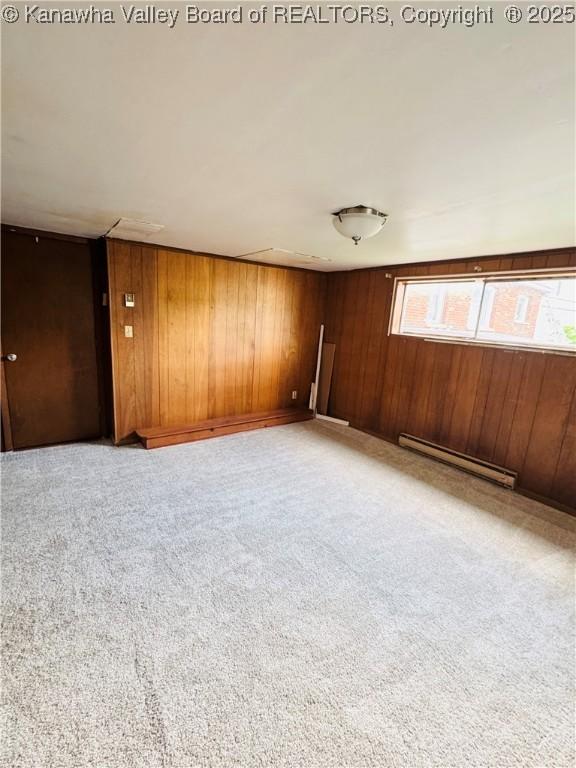 8612 Maryland Ave, Marmet, WV 25315 - carpeted spare room with baseboard heating and wooden walls