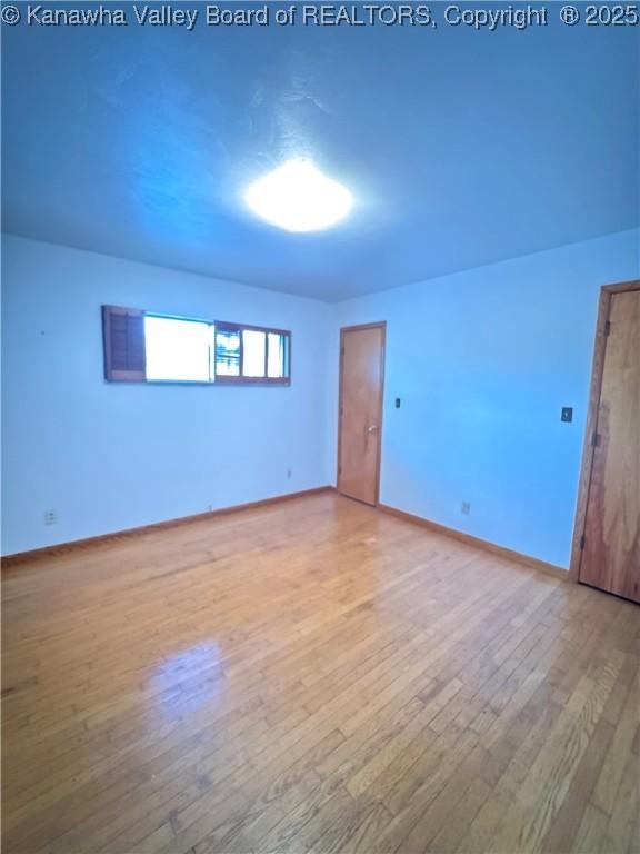 8612 Maryland Ave, Marmet, WV 25315 - empty room with wood finished floors