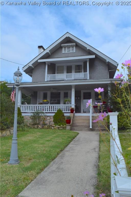 810 Maple Rd, Charleston, WV 25302 - view of front of house with covered porch, a front yard, and a balcony