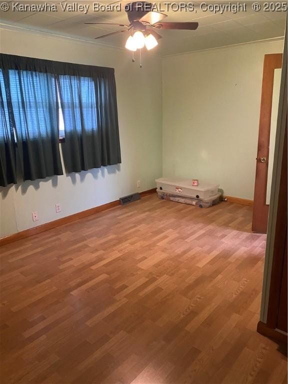 510 S Railway St, Cedar Grove, WV 25039 - spare room with ornamental molding, wood finished floors, and a ceiling fan