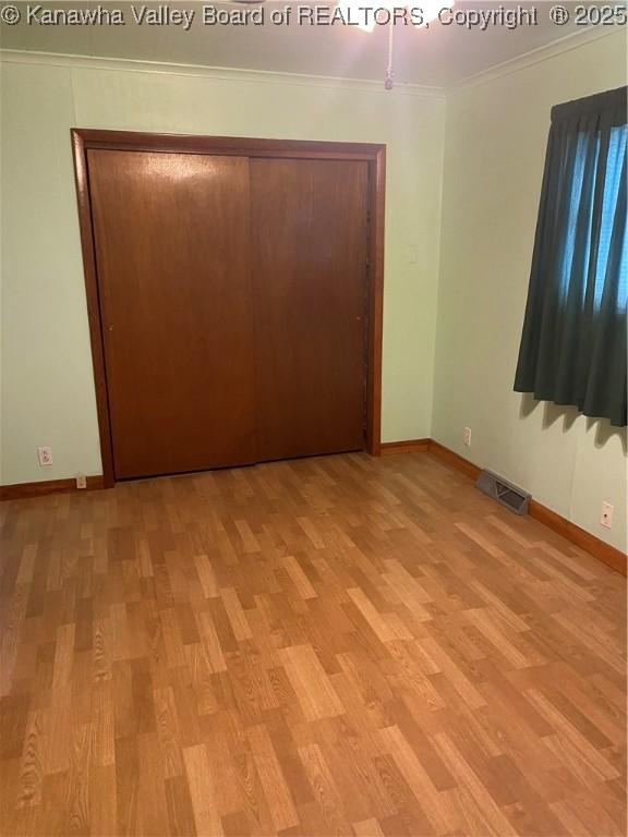 510 S Railway St, Cedar Grove, WV 25039 - empty room featuring light wood-type flooring and ornamental molding