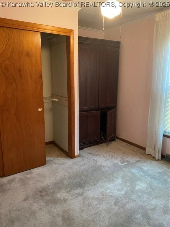 510 S Railway St, Cedar Grove, WV 25039 - unfurnished bedroom with light colored carpet, ornamental molding, and a closet