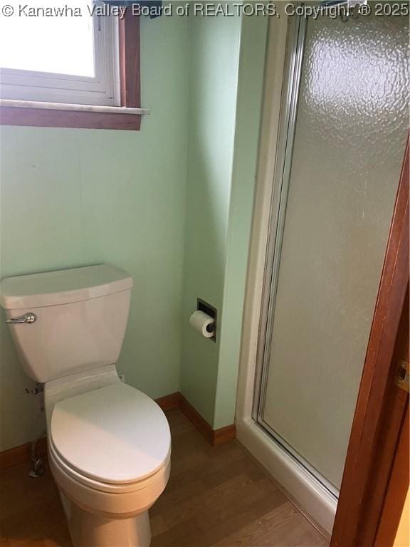 510 S Railway St, Cedar Grove, WV 25039 - bathroom featuring a stall shower and wood finished floors
