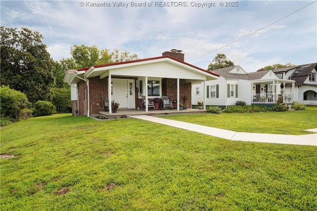 1204 Highland Dr, Saint Albans, WV 25177 - view of front of house featuring a porch, brick siding, a front yard, and a chimney