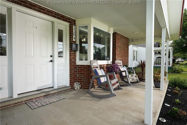1204 Highland Dr, Saint Albans, WV 25177 - entrance to property with a porch and brick siding