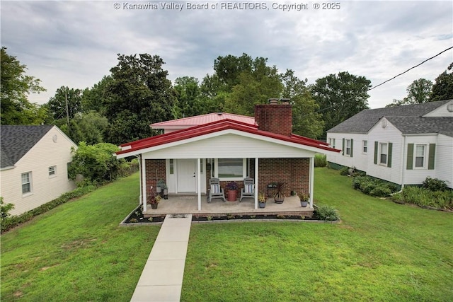 1204 Highland Dr, Saint Albans, WV 25177 - bungalow-style house featuring covered porch, brick siding, and a front lawn
