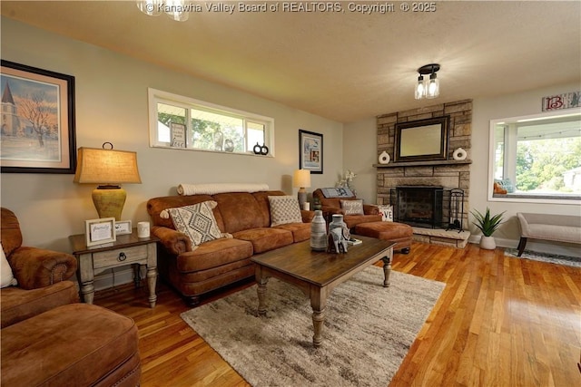 1204 Highland Dr, Saint Albans, WV 25177 - living room featuring light wood-style floors and a stone fireplace