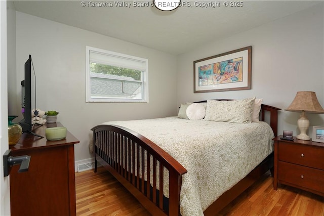 1204 Highland Dr, Saint Albans, WV 25177 - bedroom featuring wood finished floors and baseboards