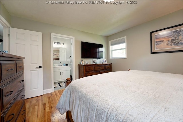 1204 Highland Dr, Saint Albans, WV 25177 - bedroom featuring light wood-style flooring and ensuite bath