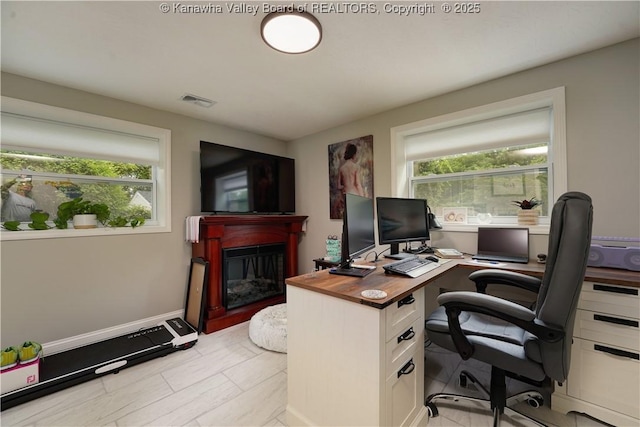 1204 Highland Dr, Saint Albans, WV 25177 - office space with plenty of natural light and a glass covered fireplace