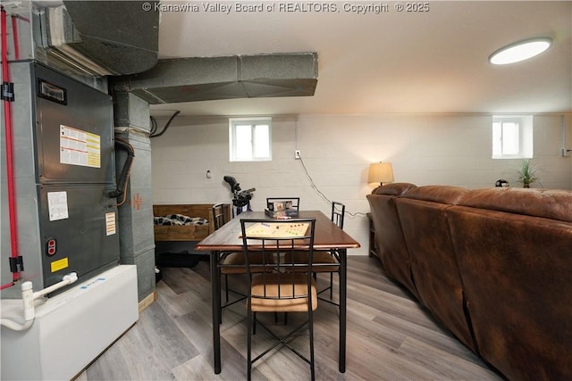 1204 Highland Dr, Saint Albans, WV 25177 - dining area featuring light wood-style flooring, healthy amount of natural light, concrete block wall, and heating unit