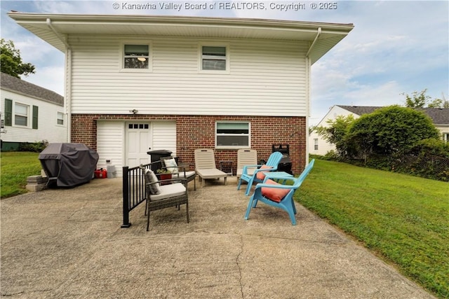 1204 Highland Dr, Saint Albans, WV 25177 - rear view of house featuring brick siding, a patio area, and a lawn