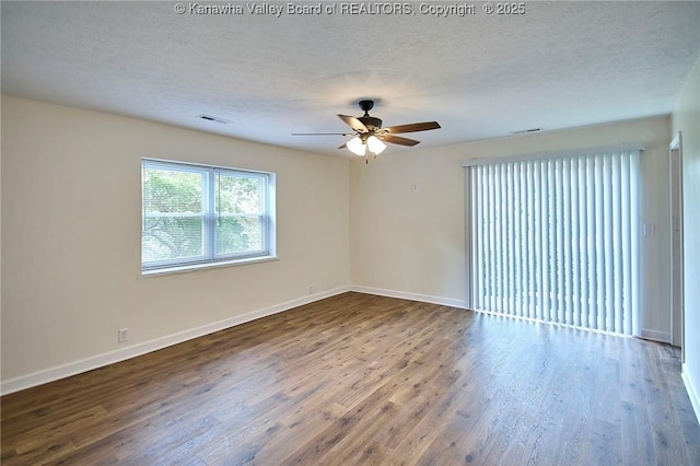 4013 Seymour Ln, Charleston, WV 25313 - spare room featuring ceiling fan, wood finished floors, and a textured ceiling