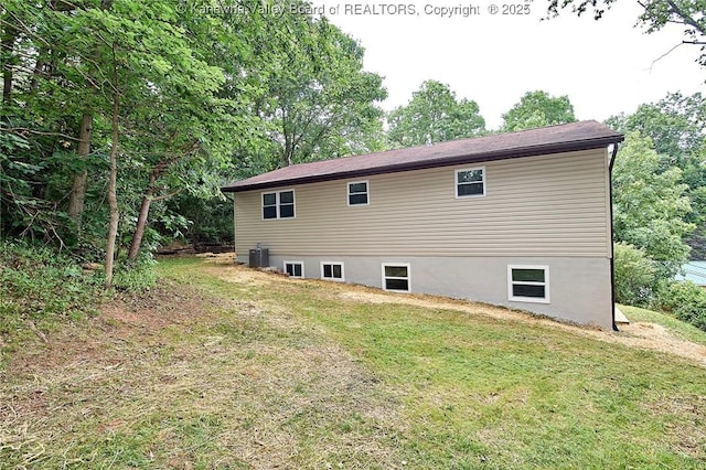 4013 Seymour Ln, Charleston, WV 25313 - view of property exterior with a lawn and a central AC unit