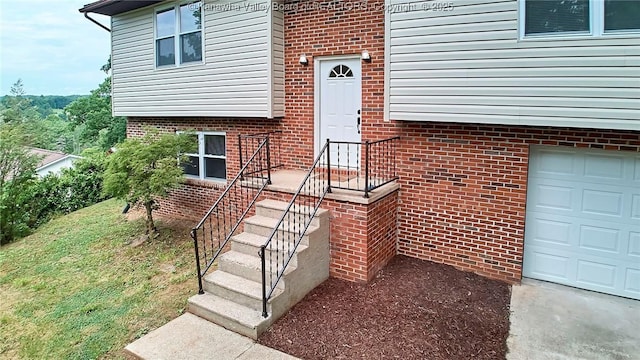 4013 Seymour Ln, Charleston, WV 25313 - view of exterior entry featuring a garage and brick siding
