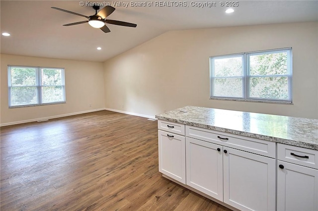 4013 Seymour Ln, Charleston, WV 25313 - kitchen with vaulted ceiling, wood finished floors, ceiling fan, white cabinets, and recessed lighting