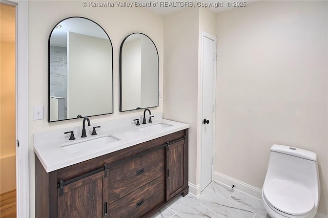 4013 Seymour Ln, Charleston, WV 25313 - bathroom featuring double vanity and marble look tiles