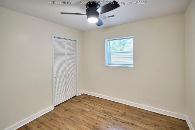 4013 Seymour Ln, Charleston, WV 25313 - unfurnished bedroom featuring a closet, wood finished floors, and ceiling fan
