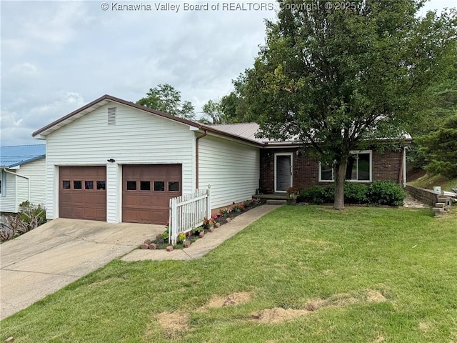 5005 Buffy Dr, Cross Lanes, WV 25313 - ranch-style home featuring a garage, concrete driveway, and a front yard