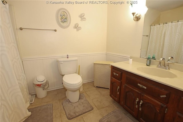 5005 Buffy Dr, Cross Lanes, WV 25313 - bathroom with wainscoting, vanity, tile patterned flooring, and curtained shower