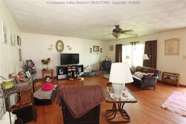 5005 Buffy Dr, Cross Lanes, WV 25313 - living area with ceiling fan, wood finished floors, and a wood stove